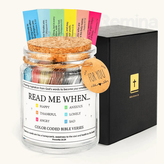 A close-up of the Handmade Bible Verses Jar filled with rolled color-coded Scripture notes for different emotions like happy, anxious, and thankful, with a cork lid and a “For You” gift tag, placed beside a sleek black Christian Gift Box